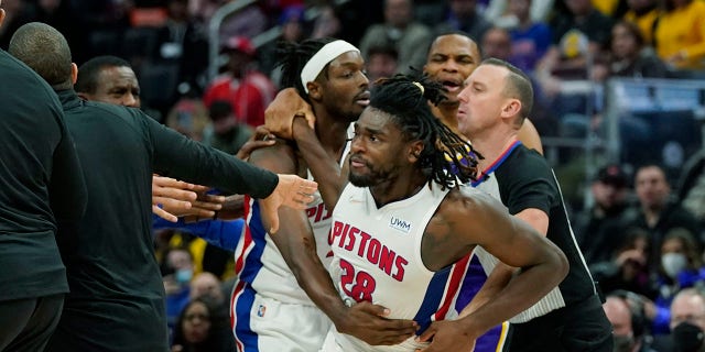 Detroit Pistons center Isaiah Stewart (28) is held back after a foul during the second half of an NBA basketball game against the Los Angeles Lakers, Sunday, Nov. 21, 2021, in Detroit.