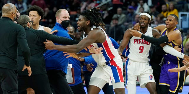 Detroit Pistons center Isaiah Stewart (28) is held back after a foul during the second half against the Los Angeles Lakers Sunday, Nov. 21, 2021, in Detroit.