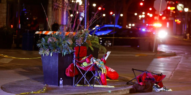 Toppled chairs are seen among holiday decorations in downtown Waukesha, Wis., after an SUV plowed into a Christmas parade injuring dozens of people Sunday, Nov 21. 2021. (AP Photo/Jeffrey Phelps)