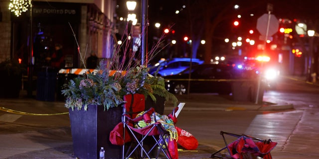 Toppled chairs are seen among holiday decorations in downtown Waukesha, Wis., after an SUV plowed into a Christmas parade injuring dozens of people Sunday, Nov 21. 2021.