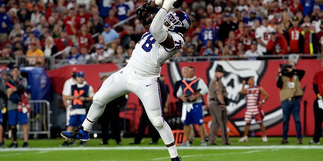 New York Giants' Andrew Thomas scores on a 2-yard touchdown pass against the Buccaneers on Monday, Nov. 22, 2021, in Tampa, Florida.