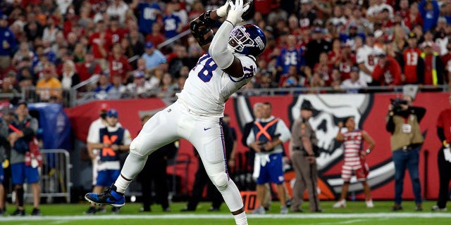 New York Giants' Andrew Thomas scores on a 2-yard touchdown pass against the Buccaneers on Monday, Nov. 22, 2021, in Tampa, Florida.