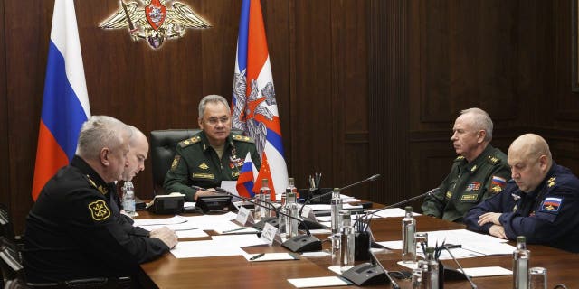 Russian Defense Minister Sergei Shoigu (center) participates in a video call with China's Wei Fenghe in Moscow, Russia, Tuesday, November 23, 2021. Shoigu and Wei signed a roadmap for military cooperation between Moscow and Beijing, conducting joint training and patrols.