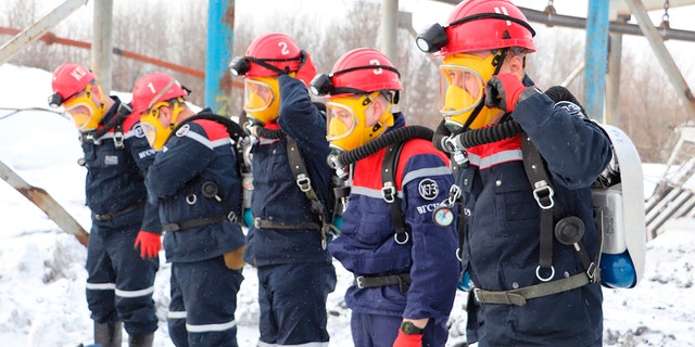 In this Russian Emergency Situations Ministry Thursday, Nov. 25, 2021 photo, rescuers prepare to work at a fire scene at a coal mine near the Siberian city of Kemerovo, about 3,000 kilometres (1,900 miles) east of Moscow, Russia. (Russian Ministry for Emergency Situations photo via AP)