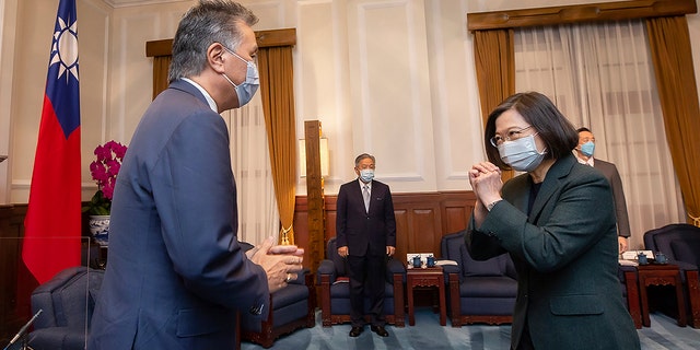 U.S. Rep. Mark Takano, D-Calif., left, is greeted by Taiwanese President Tsai Ing-wen at the Presidential Office in Taipei, Taiwan on Friday. Five U.S. lawmakers met with Tsai in a surprise one-day visit intended to reaffirm America's "rock solid" support for the self-governing island. 