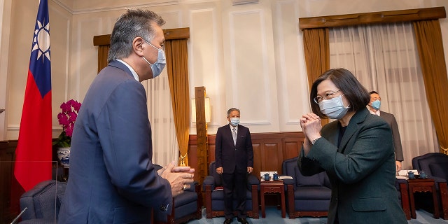 U.S. Rep. Mark Takano, D-Calif., left, is greeted by Taiwanese President Tsai Ing-wen at the Presidential Office in Taipei, Taiwan on Friday. Five U.S. lawmakers met with Tsai in a surprise one-day visit intended to reaffirm America's "rock solid" support for the self-governing island.