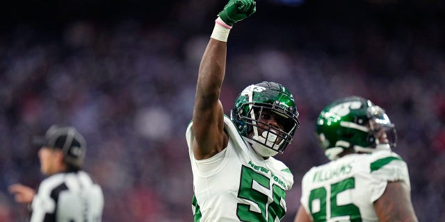 New York Jets outside linebacker Quincy Williams (56) celebrates a sack in the first half against the New York Jets in Houston, Sunday, Nov. 28, 2021.