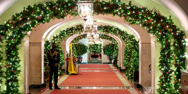 The Center Hall of the White House is decorated for the holiday season during a press preview of the White House holiday decorations, Monday, Nov. 29, 2021, in Washington. 