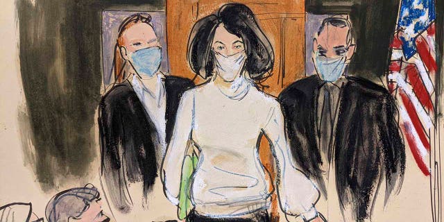 Ghislaine Maxwell enters the courtroom escorted by U.S. Marshalls at the start of her trial