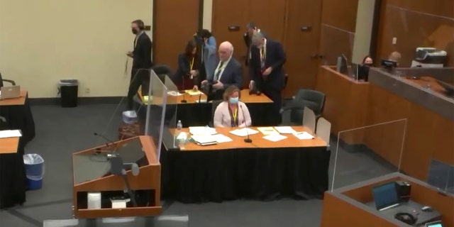 In this screen grab from video, former Brooklyn Center police Officer Kim Potter sits at the defense table, center, as Hennepin County Judge Regina Chu presides over jury selection Tuesday, Nov. 30, 2021. (Court TV via AP, Pool)