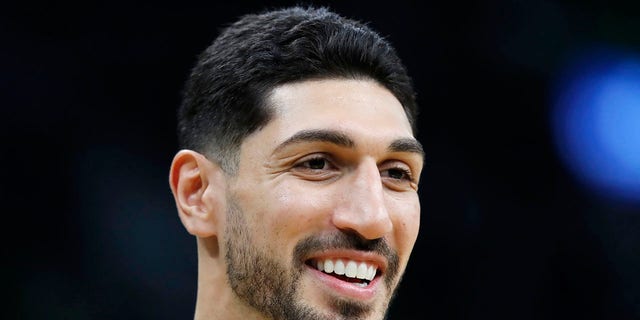 FILE - Boston Celtics' Enes Kanter smiles before an NBA basketball game against the Toronto Raptors, on Oct. 22, 2021, in Boston. The Celtics center changed his name from Enes Kanter, to Enes Kanter Freedom, in celebration of him officially becoming a United States citizen on Monday, Nov. 29, 2021.