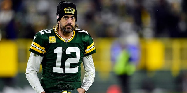 Aaron Rodgers #12 of the Green Bay Packers walks off the field after defeating the Seattle Seahawks 17-0 at Lambeau Field in Green Bay, Wisconsin, Nov. 14, 2021.