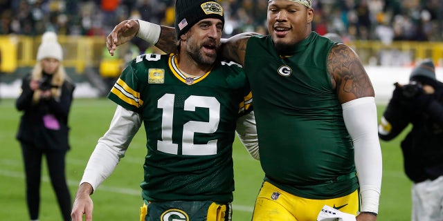 Green Bay Packers' Aaron Rodgers and Preston Smith walk off the field after an NFL football game against the Seattle Seahawks Sunday, Nov.. 14, 2021, in Groenbaai, Wisconsin. The Packers won 17-0.