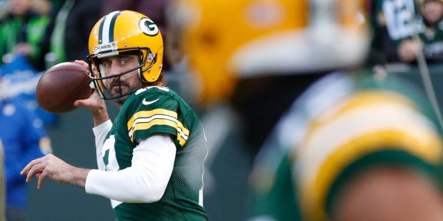 Aaron Rodgers warms up before the Seattle Seahawks game Sunday, Nov. 14, 2021, in Green Bay, Wisconsin.