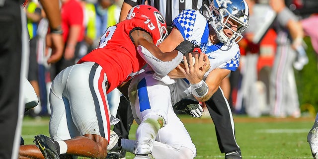 ATHENS, GA  OCTOBER 16:  Georgia linebacker Adam Anderson (19) tackles Kentucky quarterback Will Levis (7) during the college football game between the Kentucky Wildcats and the Georgia Bulldogs on October 16th, 2021 at Sanford Stadium in Athens, GA. 