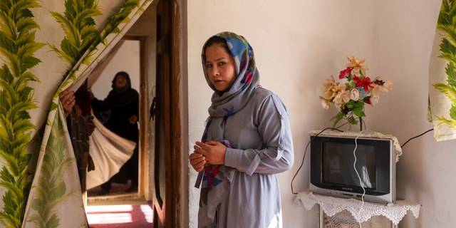 Najiba stands in her home in Kabul, Afghanistan, Thursday, Nov. 18, 2021.