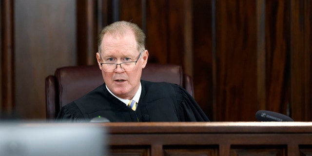 Superior Court Judge Timothy Walmsley speaks during opening statements  in the trial of Greg McMichael and his son, Travis McMichael, and a neighbor, William "Roddie" Bryan at the Glynn County Courthouse, Friday, Nov. 5, 2021, in Brunswick, Ga.  The three are charged with the February 2020 slaying of 25-year-old Ahmaud Arbery.  