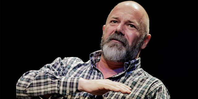 WASHINGTON, DC - APRIL 04: Andrew Sullivan, editor of The Dish, leads a discussion with Michael Lewis, a financial journalist and author, in the Newsmaker Series of talks at George Washington University on April 4, 2014 in Washington, DC. Lewis's latest book, "Flash Boys: A Wall Street Revolt," tells the story of the Canadian banker who uncovered the underhanded and illegal practices carried out by some high-frequency traders on Wall Street. (Photo by T.J. Kirkpatrick/Getty Images)