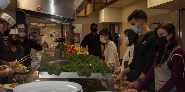 NAVAL AIR FACILITY ATSUGI, Japan - Sailors and their families attend a Thanksgiving meal at the Naval Air Facility (NAF) Atsugi base Far East Cafe galley on Nov. 25, 2021. (U.S. Navy photo by Mass Communication Specialist 1st Class Richard L.J. Gourley)