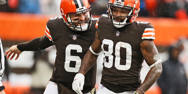 Browns quarterback Baker Mayfield congratulates wide receiver Jarvis Landry after his 16-yard touchdown against the Detroit Lions on Nov. 21, 2021, in Cleveland.