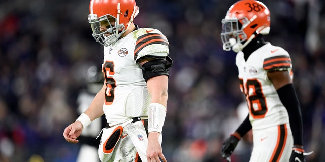 Cleveland Browns quarterback Baker Mayfield and cornerback A.J. Green head to the bench against the Ravens Nov. 28, 2021, in Baltimore.