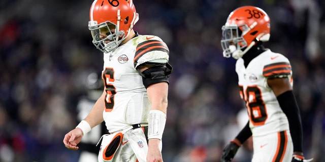 Cleveland Browns quarterback Baker Mayfield (6) and cornerback A.J. Green (38) head to the bench after a series against the Baltimore Ravens during the second half of an NFL football game, Sunday, Nov. 28, 2021, in Baltimore.