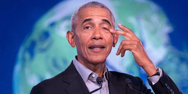 Former U.S. President Barack Obama gestures as he speaks during the COP26 U.N. Climate Summit in Glasgow, Scotland, Monday, Nov. 8, 2021.   (Jane Barlow/PA via AP)