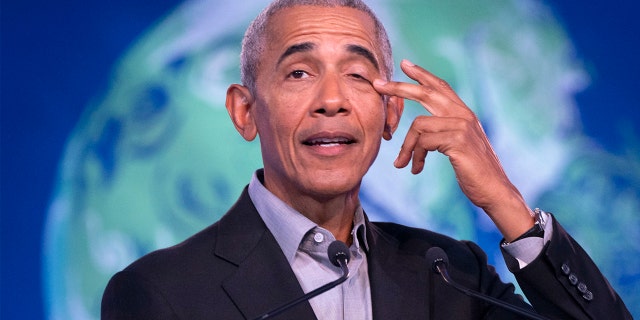 Former U.S. President Barack Obama gestures as he speaks during the COP26 U.N. Climate Summit in Glasgow, Scotland, Monday, Nov. 8, 2021. (Jane Barlow/PA via AP)