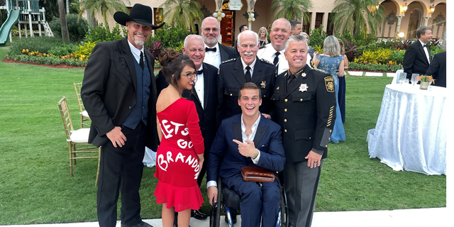 Rep. Lauren Boebert, R-Colo., and Rep. Madison Cawthorn, R-N.C., pose with others at Mar-a-Lago in Palm Beach, Florida.