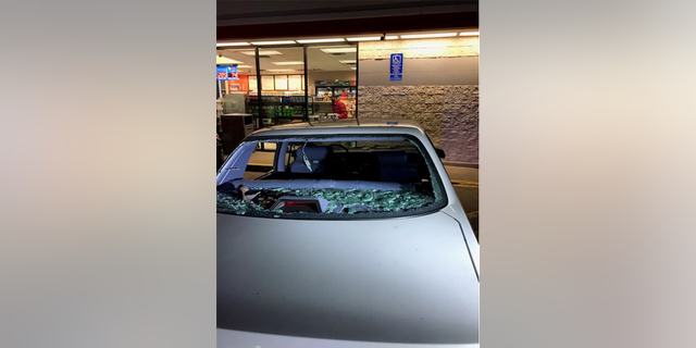 The rear window of the victim's car. 