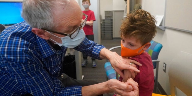 Matthew Cushman, 7, receives his COVID-19 vaccination at the Salt Lake County Health Department Wednesday, Nov. 3, 2021, in Salt Lake City.