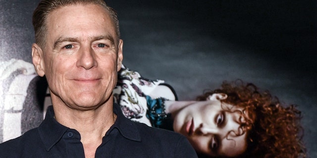 Bryan Adams stands in front of the picture "Karen on a dolly" in his 2018 exhibition in the gallery Camera Work. (Photo by Jens Kalaene/picture alliance via Getty Images)