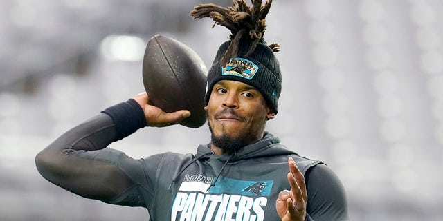 Carolina Panthers quarterback Cam Newton warms up before the Cardinals game Nov. 14, 2021, in Glendale, Arizona.