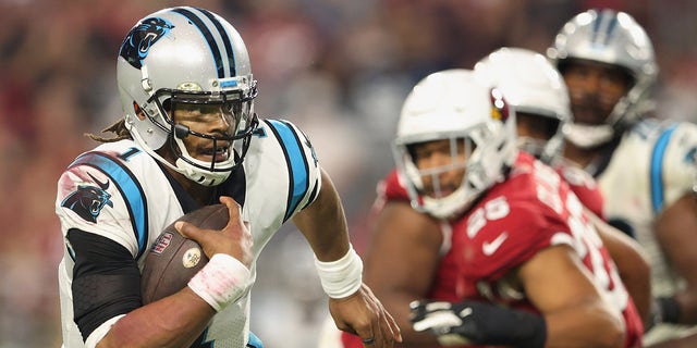 GLENDALE, ARIZONA - NOVEMBER 14: Quarterback Cam Newton #1 of the Carolina Panthers scrambles with the football against the Arizona Cardinals during the fourth quarter of the NFL game at State Farm Stadium on November 14, 2021 in Glendale, Arizona. The Panthers defeated the Cardinals 34-10. 