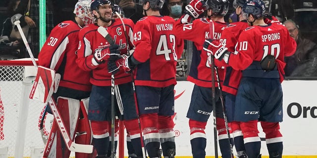 Washington Capitals celebrate a 2-0 win over the Los Angeles Kings after their NHL hockey game Wednesday, Nov. 17, 2021, in Los Angeles.