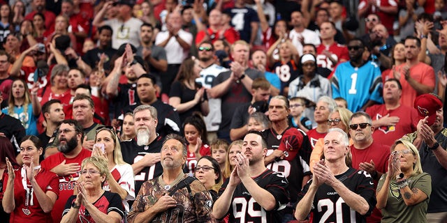 GLENDALE, ARIZONA - NOVEMBER 14: A general view of fans applauding during the singing of the national anthem before the game between the Carolina Panthers and the Arizona Cardinals at State Farm Stadium on November 14, 2021 in Glendale, Arizona.