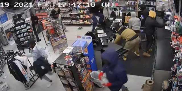 Suspects are seen looting a store in Chicago's Chatham neighborhood on Friday night. (Chicago Police)