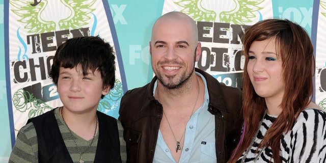 Chris Daughtry poses with his stepchildren Griffin and Hannah Daughtry.