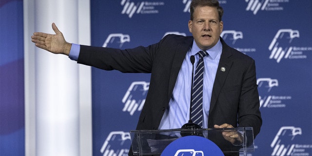 New Hampshire Governor Chris Sununu gestures as he speaks during the Republican Jewish Coalition (RJC) annual leadership meeting in Las Vegas on Friday, November 5, 2021.  Photographer: Bridget Bennett / Bloomberg via Getty Images