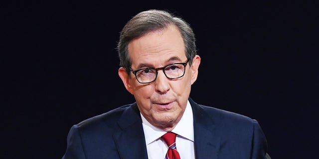 Debate moderator and Fox News anchor Chris Wallace directs the first presidential debate between U.S. President Donald Trump and Democratic presidential nominee Joe Biden on Sept. 29, 2020, in Cleveland, Ohio.