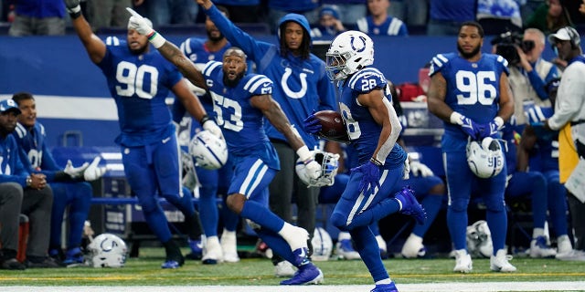 Indianapolis Colts' Jonathan Taylor (28) runs for a touchdown during the second half of an NFL football game against the New York Jets, Thursday, Nov. 4, 2021, in Indianapolis.