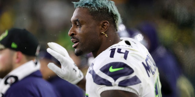 DK Metcalf #14 of the Seattle Seahawks reacts against the Green Bay Packers during the second half at Lambeau Field on November 14, 2021 in Green Bay, Wisconsin.