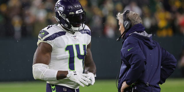 DK Metcalf #14 of the Seattle Seahawks is ejected from the game following an altercation during a game against the Green Bay Packers at Lambeau Field on November 14, 2021 in Green Bay, Wisconsin. The Packers defeated the Seahawks 17-0.