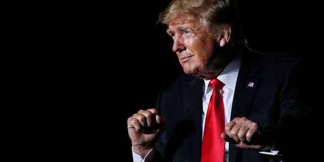 Former President Trump reacts after his speech during a rally at the Iowa States Fairgrounds in Des Moines, Iowa, October 9, 2021.