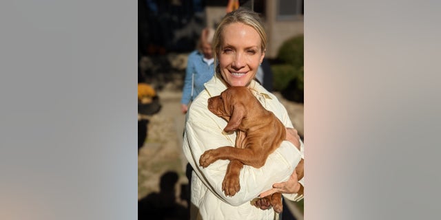 Dana Perino holding her new dog, Percy, during his early puppy days. She introduced him to Fox News viewers in Nov. 2021.