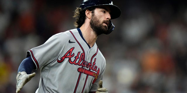 Atlanta Braves' Dansby Swanson celebrates a two-run home run during the fifth inning in Game 6 of baseball's World Series between the Houston Astros and the Atlanta Braves Tuesday, Nov. 2, 2021, in Houston.