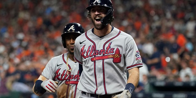 Atlanta Braves' Dansby Swanson celebrates a two-run home run during the fifth inning in Game 6 of baseball's World Series between the Houston Astros and the Atlanta Braves Tuesday, Nov. 2, 2021, in Houston.