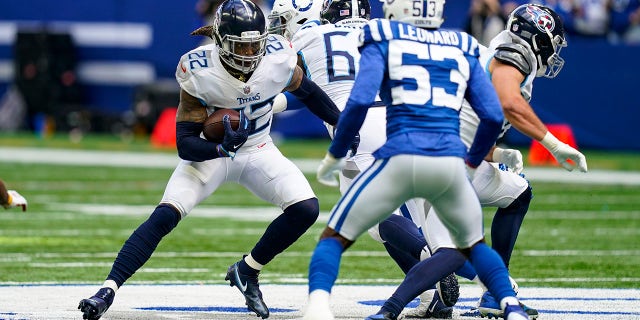 Tennessee Titans running back Derrick Henry (22) cuts away from Indianapolis Colts outside linebacker Darius Leonard (53) in the first half of an NFL football game in Indianapolis, Sunday, Oct. 31, 2021.