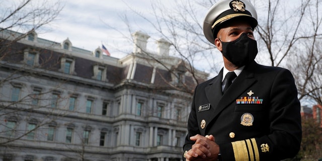 U.S. Surgeon General Jerome Adams takes questions from news reporters outside of the West Wing at the White House in Washington, D.C., Dec. 21, 2020.