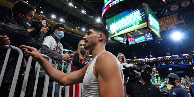 Nov 10, 2021; Boston, Massachusetts, USA; Boston Celtics center Enes Kanter (13) signs autographs before the start of the game against the Toronto Raptors at TD Garden. 